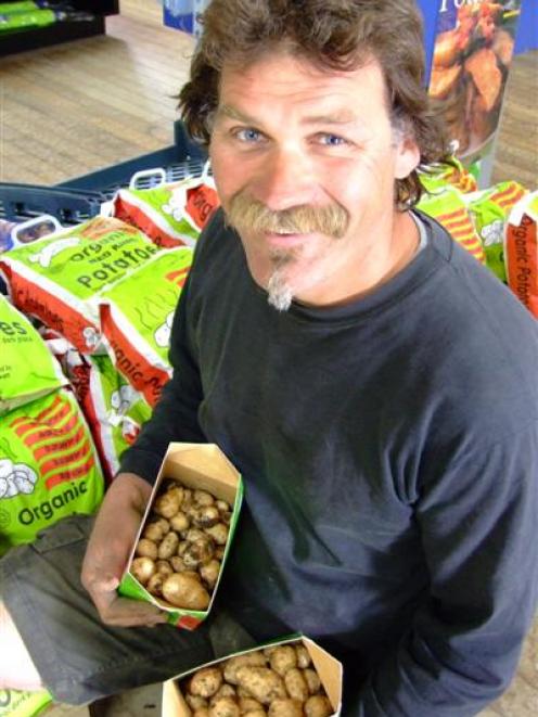 Marty Quennell has dug the first of the season's new potatoes at his Brydone Growers market...