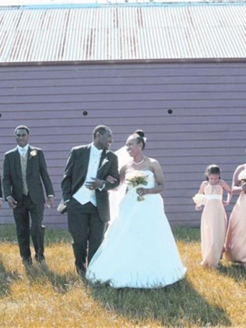 Marvin and Geua with their wedding party following their marriage in Palmerston. Photo by Moira...