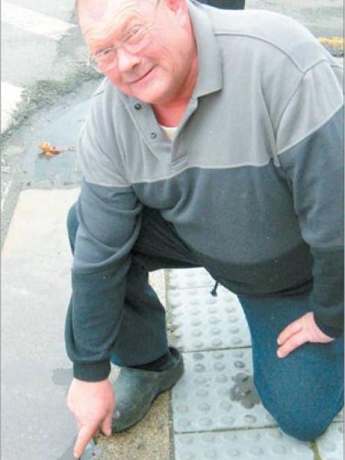 Mataura contractor and resident Peter Byron points to a protruding bolt which he says contributed...