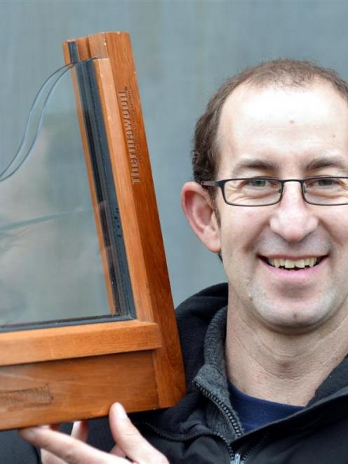 Matt Lamb, from Thermawood Otago, with an example of the retrofit double-glazing system. Photo by...