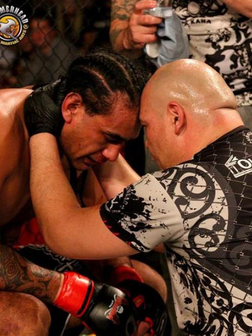 Matt Toa consoles Apii Taia after calling a halt to his ISKA NZ pro heavyweight title fight...