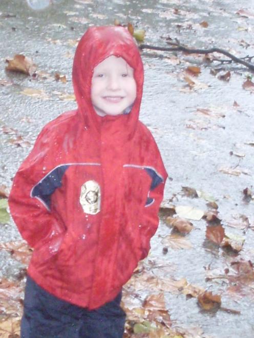 Matthew Dober (4), the son of former Dunedin woman Sandra Mooney, braves the wild weather near...