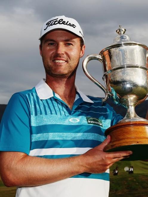 Matthew Griffin poses with the trophy after his victory in the New Zealand Open. Photo Getty Images