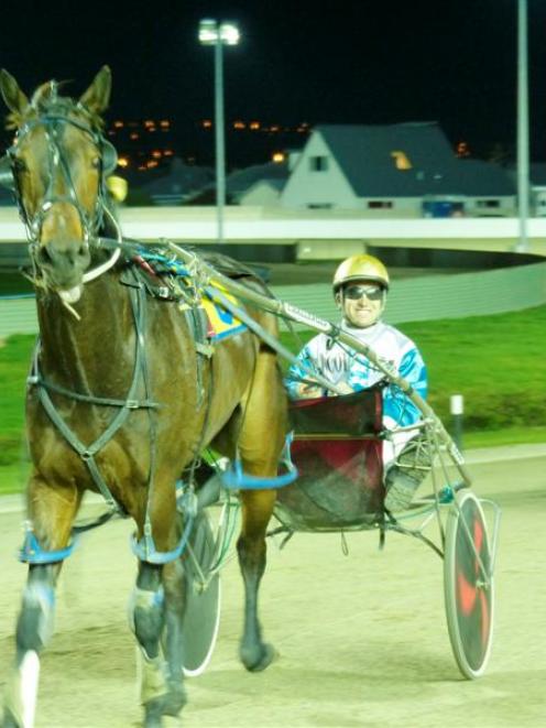 Matthew Williamson smiles after his 96th driving win of the season, courtesy of Lucky Getaway at...