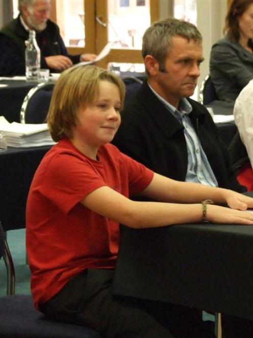 Max Rayner (12) gives evidence at the Nevis river hearing in Cromwell yesterday. Next to him is...