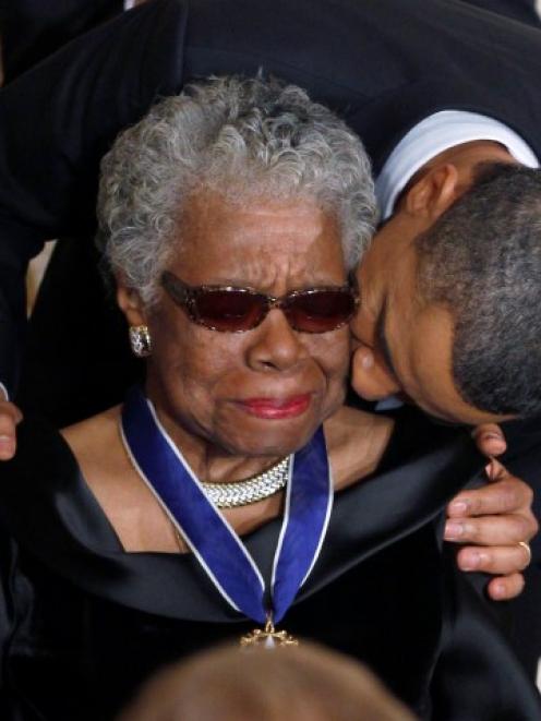 Maya Angelou receives a Medal of Freedom from US President Barack Obama at the White House in...