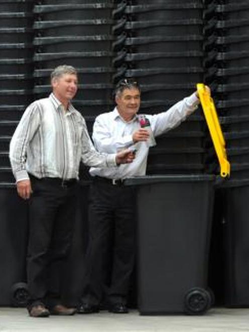 Mayor Dave Cull (right) and Cr Andrew Noone check one of 4340 new wheelie bins at a Sawyers Bay...