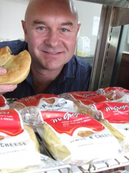 McGregor's Bakery owner-operator Bernie Sugrue is pictured tucking into one of the prize-winning...