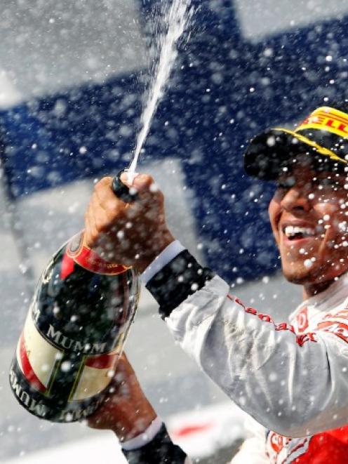 McLaren driver Lewis Hamilton of Britain celebrates after winning the Hungarian F1 Grand Prix at...