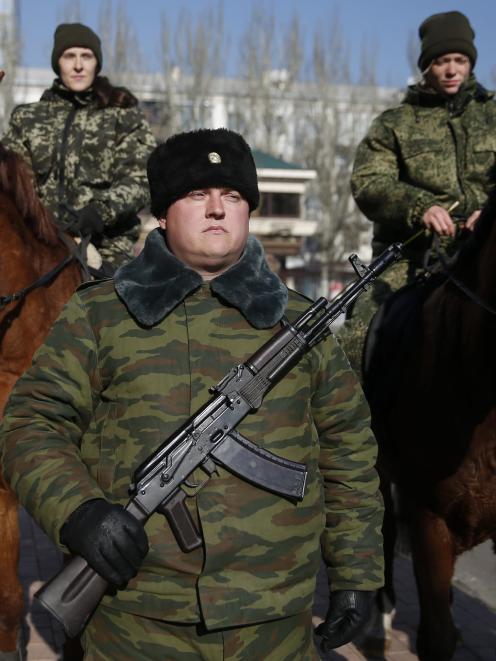Members of an honour guard wait for the arrival of separatist leader Alexander Zakharchenko in...