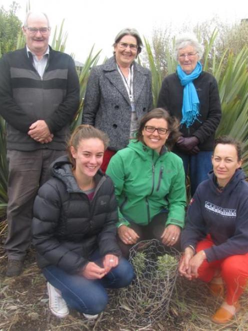 Members of Mad 4 Central Otago at a garden project on Boundary Rd, Alexandra (clockwise from back...
