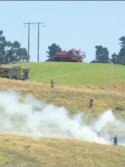 Members of the Balclutha Volunteer Fire Brigade at the fire. Photo by Helena de Reus