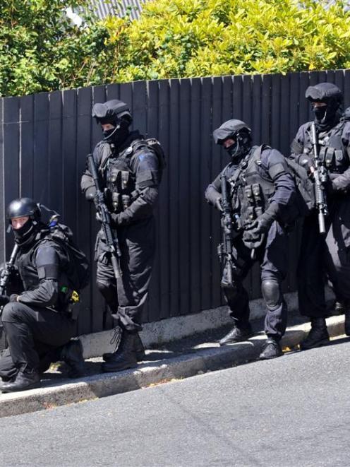 Members of the Dunedin armed offenders squad outside a Dunedin property earlier this year. Photo...