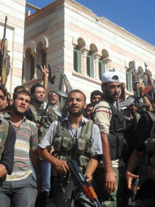 Members of the Free Syrian Army are seen in Azzaz, Aleppo province. REUTERS/Shaam News Network...