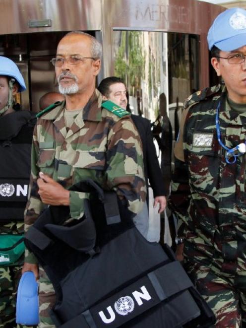 Members of the United Nations observers mission in Syria leave a hotel in Damascus, and head to...