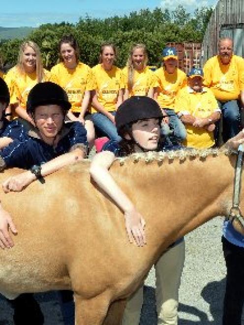 Members of the Wanaka Riding for the Disabled team introduce themselves to Owaka horse Throwa at...