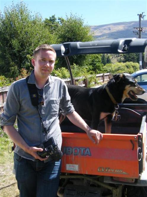 merican photographer Andrew Fladeboe with dog Ned, on Jack and Claire Davis' farm in Lowburn. ...