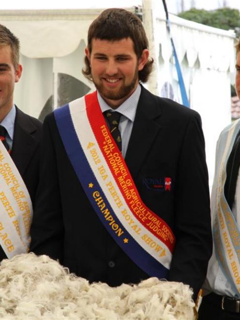 Merino fleece judging champion Will Gibson, of Middlemarch (centre), flanked by third place...