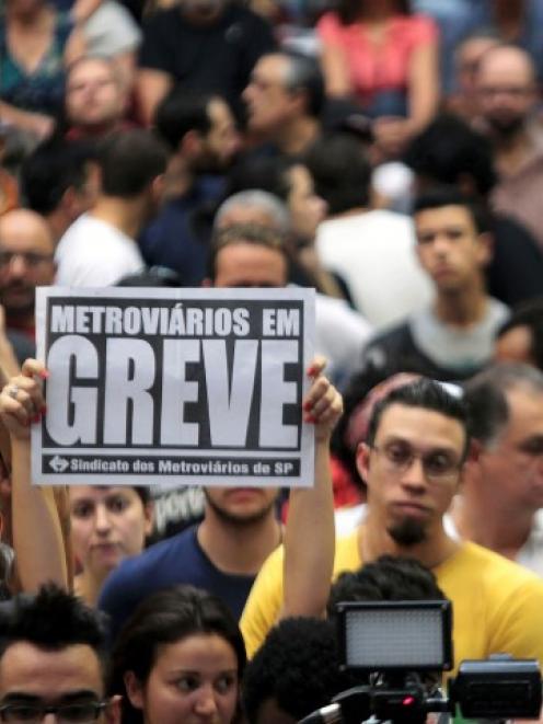 Metro workers debate whether to continue their strike at a meeting in Sao Paulo. REUTERS...