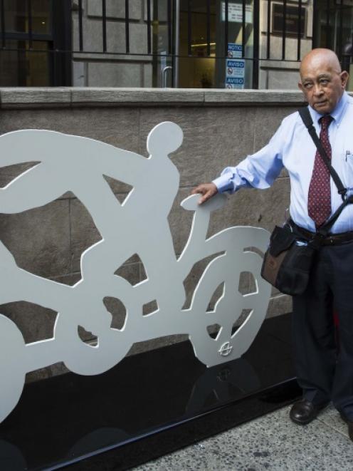 Mexican artist Gilberto Aceves Navarro with two of his bicycle sculptures in New York. The 82...