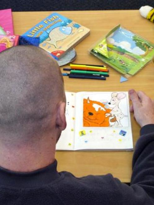 Michael, an inmate at the Otago Corrections Facility, adds the finishing touches to a story he...