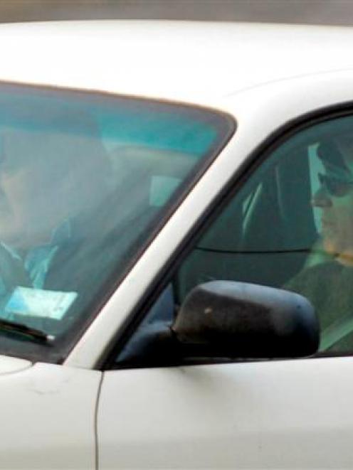 Michael Swann (right) leaves Christchurch Men's Prison early yesterday. Driving is his new...