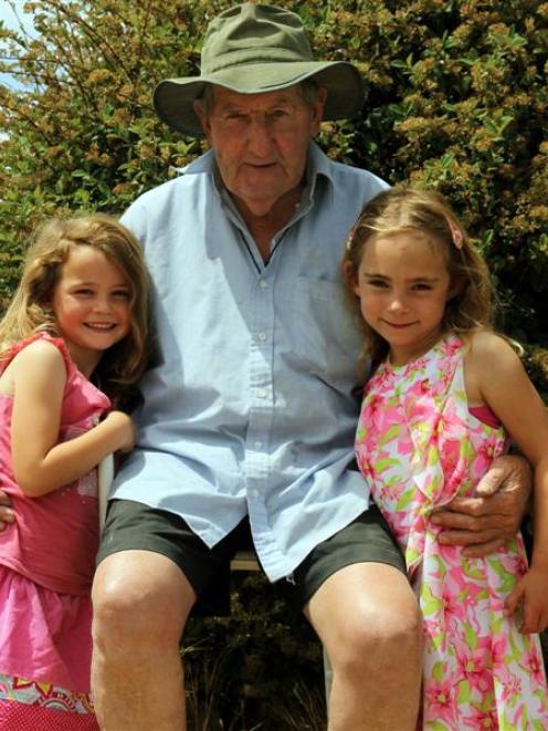 Middlemarch farmer Davie Tisdall with his grandchildren Zara Tisdall (5, left) and Ellie...