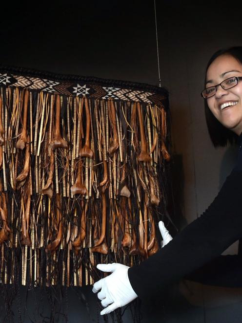 Migoto Eria, Otago Museum's curator Maori,  stands beside a Maori kilt, created by Lisa Phillips,...