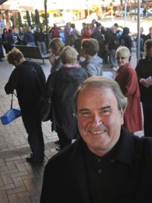 Mike Bird, of Dunedin, with his Elton John concert booking ticket, in front of the queue of...