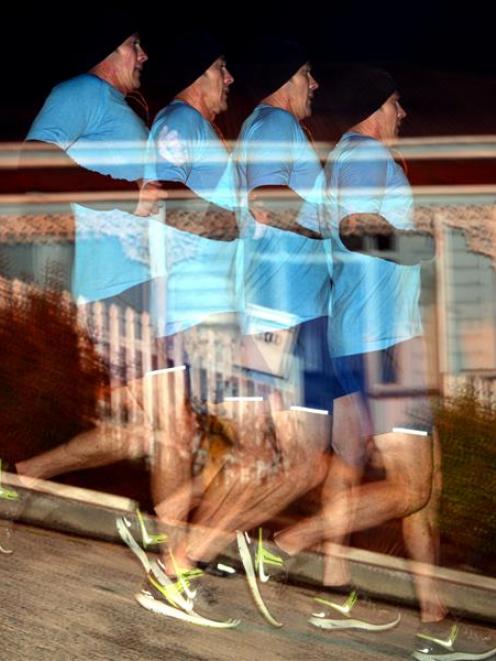 Mike Horne runs down Baldwin St, Northeast Valley, as part of a fundraiser for the Otago...