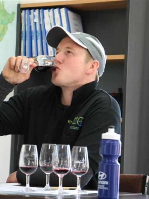 Mike Winter, of Cromwell, during the wine tasting section of a young viticulturist  competition...