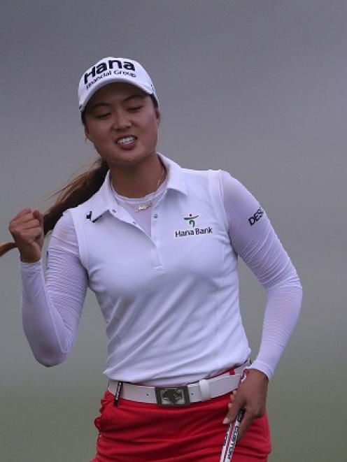 Minjee Lee celebrates making her eagle putt on the 15th hole during the final round. Photo Getty
