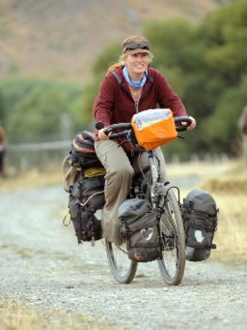 Mirjam Wouters and her long-distance travelling bicycle on the Otago Goldfields Heritage Trust's...