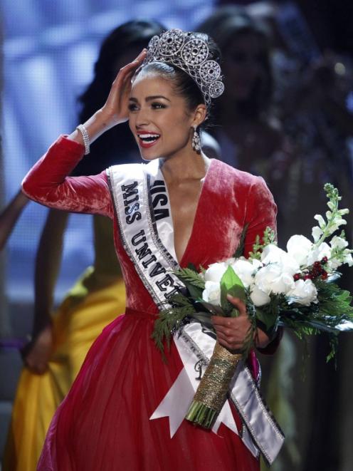 Miss USA Olivia Culpo reacts after being crowned during the Miss Universe pageant at Planet...