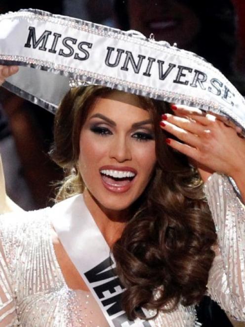 Miss Venezuela Gabriela Isler reacts after winning the Miss Universe pageant at the Crocus City...