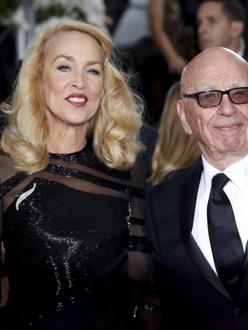 Model Jerry Hall and media magnate Rupert Murdoch announced their engagement  in an advertisement...
