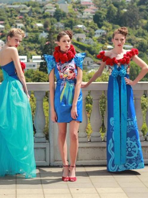 Models wear garments by Shanghai fashion designer Xinyi Li, who has been granted direct entry...