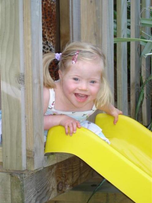 Mollie Kerruish (3) may not mind waiting for her turn on a slide, but hospital waits are not so...