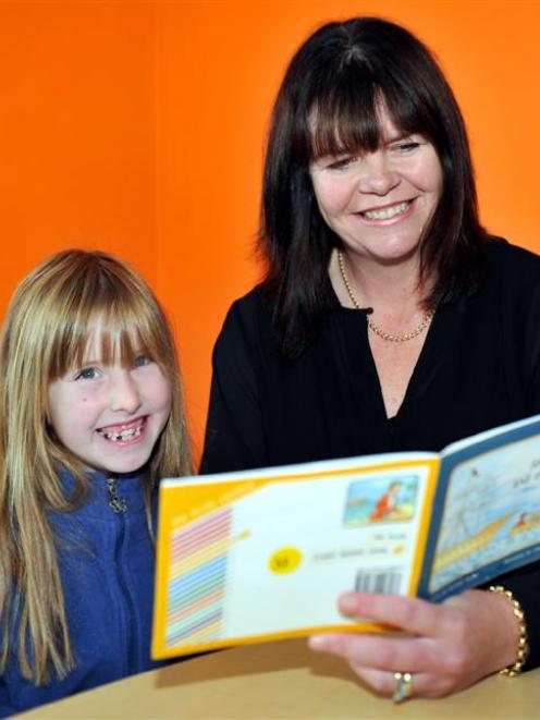 Mornington School assistant principal Carmel Jolly helps pupil Lena Crawford-Moore (7) with her...