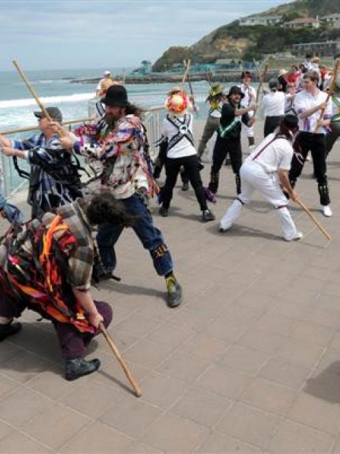 Morris dancers perform  at St Clair yesterday, during a visit to the city as part of a national...
