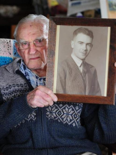 Mosgiel resident Bob Heenan holds a photograph of his brother Arthur, who was one of 17 New...