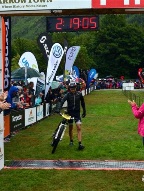 Motatapu race men's title winner Mike Crawford crosses the finish line on Saturday. Photo supplied.