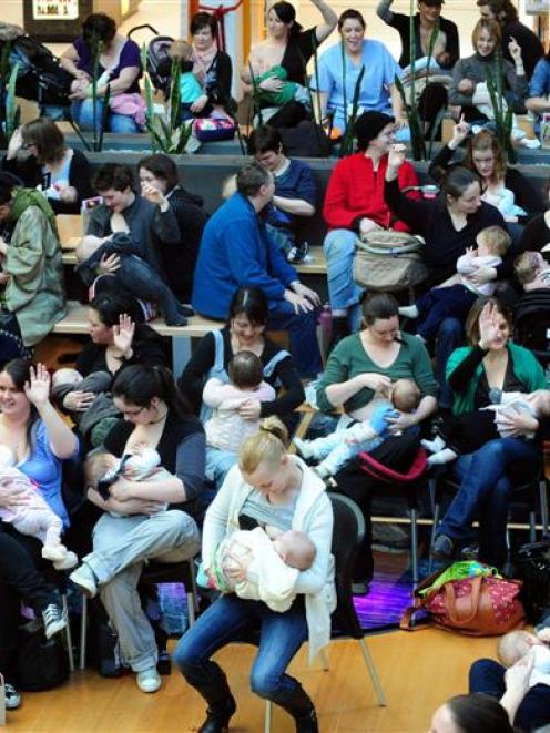 Mothers and babies latch on for Breastfeeding Awareness Week last year at Wall Street Mall,...
