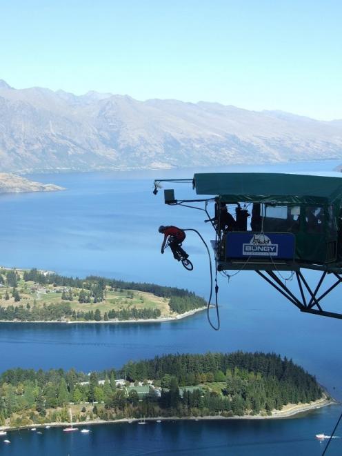 Mountain biker Kelly McGarry launches off the AJ Hackett bungy at Skyline above Queenstown. Photo...
