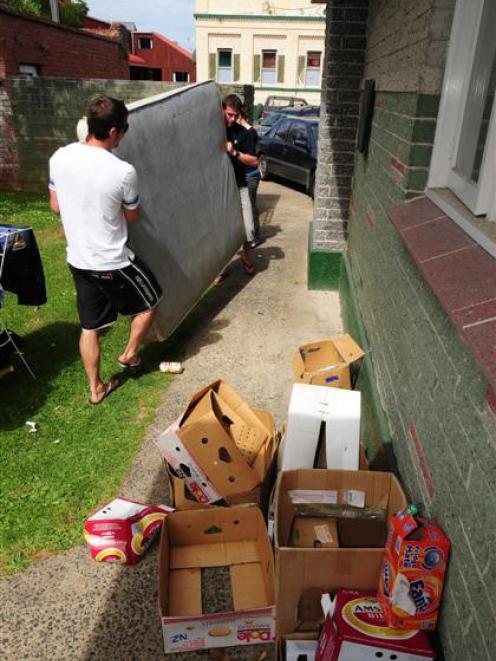 Moving into their Leith St flat are Mark Bobeer (left) and Ben Hunt. Photo by Craig Baxter.