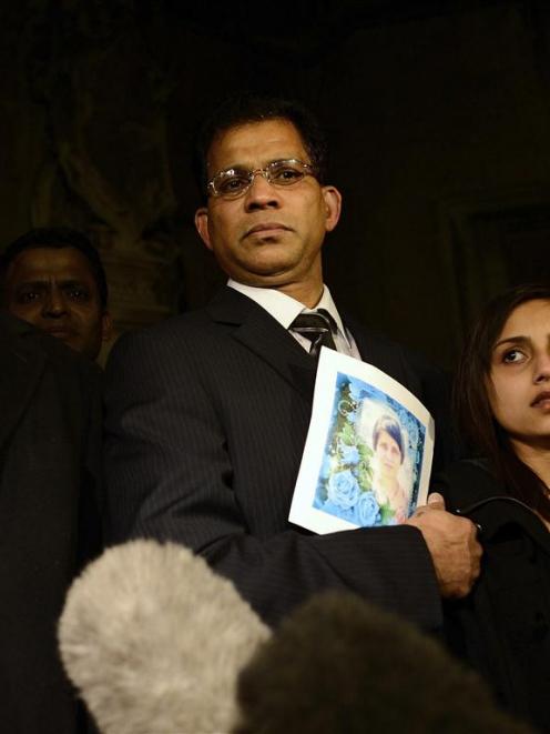 MP Keith Vaz addresses the media as Lisha Barboza stands with her father Ben while he holds a...