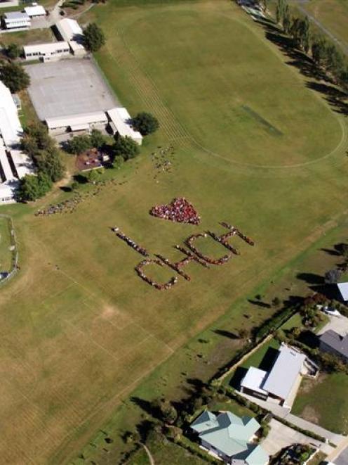 Mt Aspiring College pupils form a heart on the school field yesterday. Photo supplied.