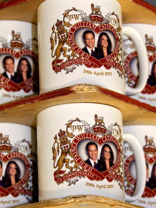 Mugs commemorating the forthcoming marriage of Britain's Prince William to Kate Middleton, are...