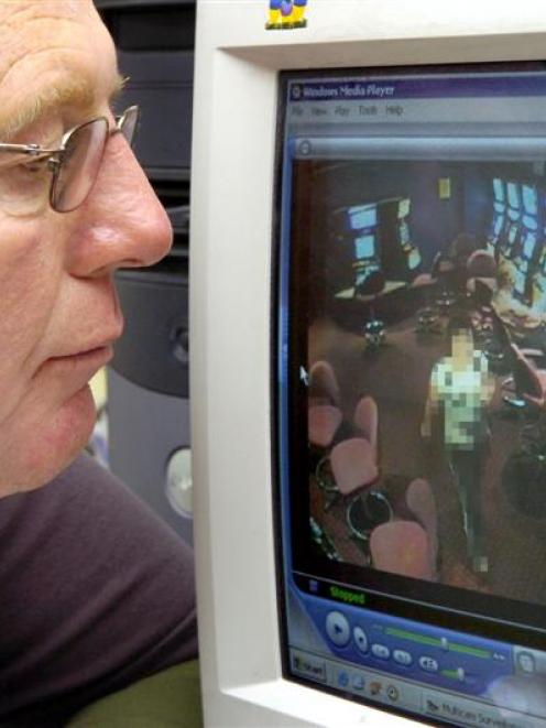 Murray Galland, of the Cableways Tavern, reviews CCTV footage of the woman alleged to have...