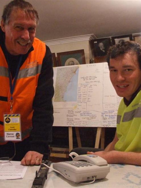 Murray Linwood (left) and Scott Ridley at work at the Waitaki Civil Defence headquarters...